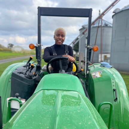 FarmerJawn driving a green tractor